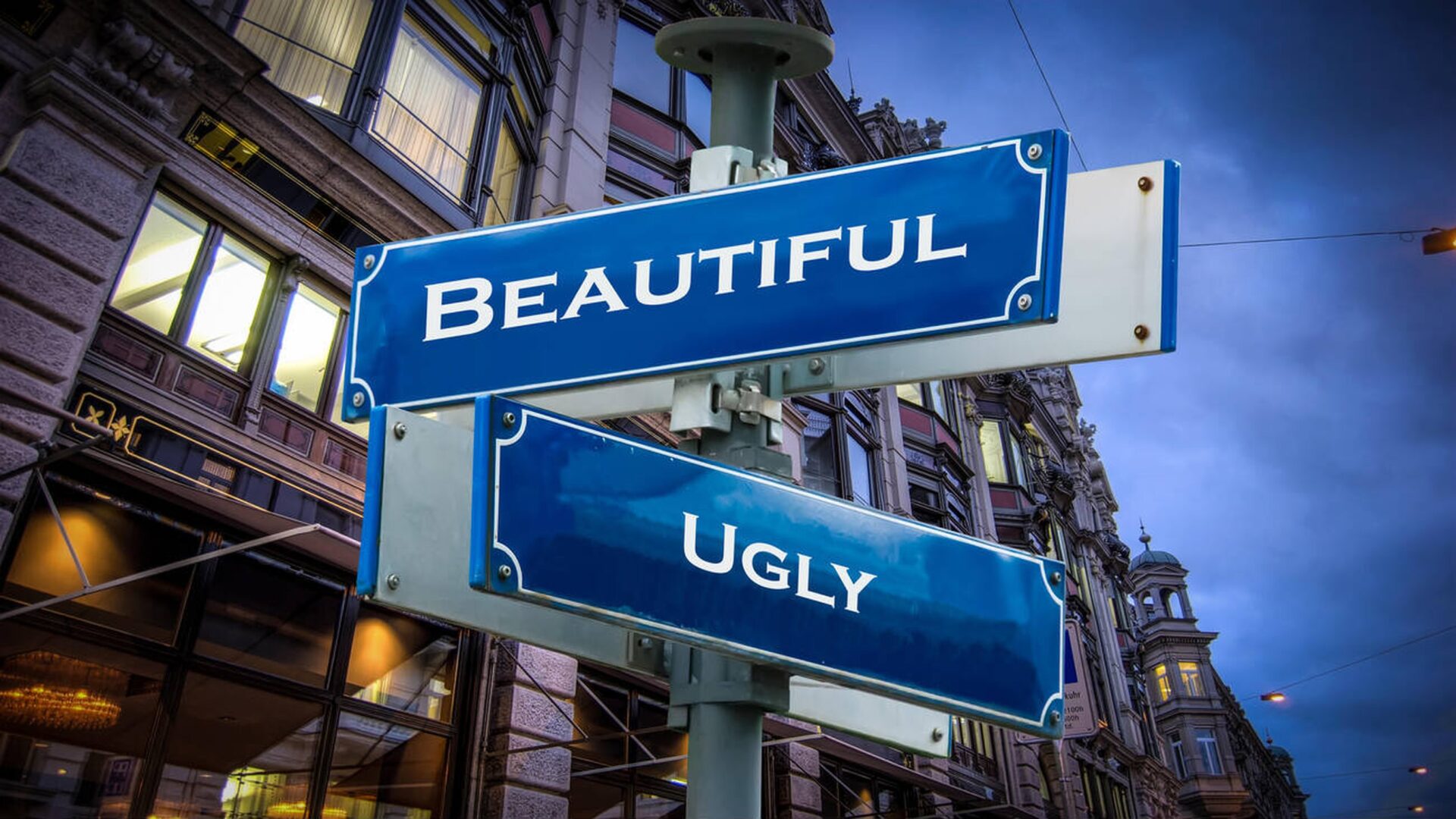 Blue street signs reading Beautiful and Ugly