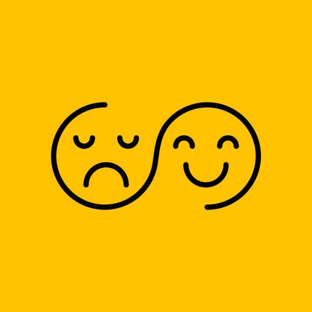 Yin-yang happy and sad faces on yellow